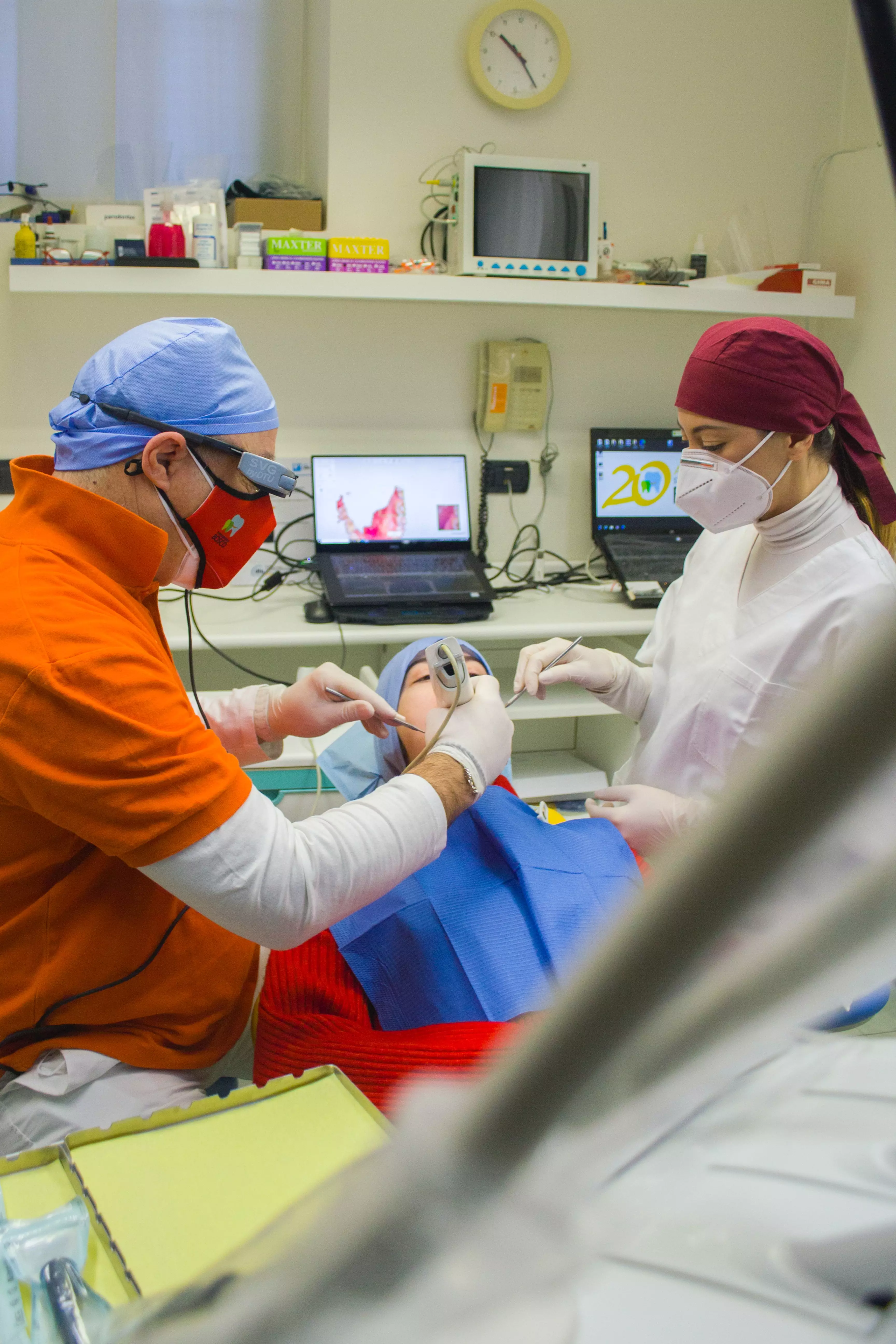 dentists performing dental implants