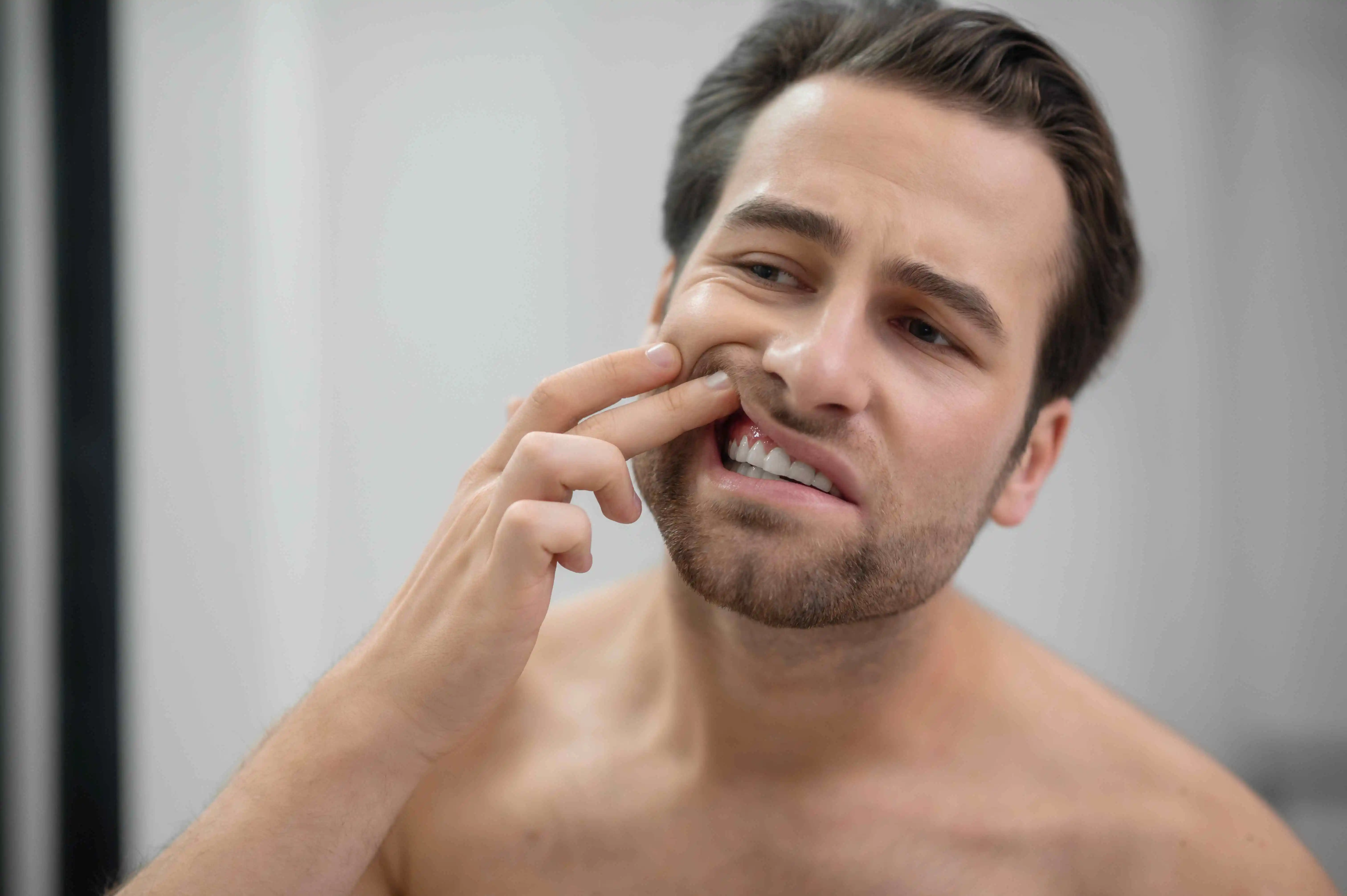man checking her Tooth Abscess